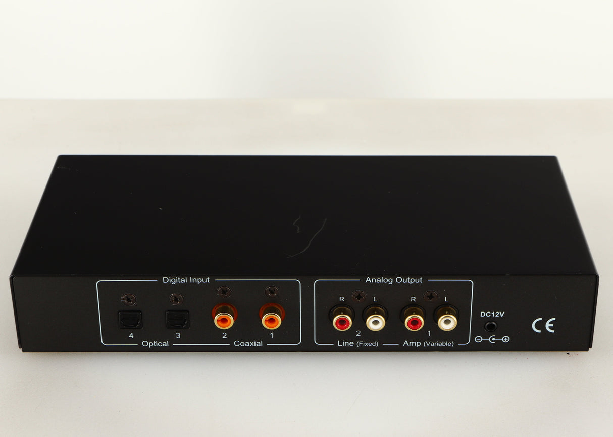 Rear view of a used Beresford TC7510 Digital Analogue Converter in a black finish showing Phono Inputs, Phono Outputs and Optical Inputs
