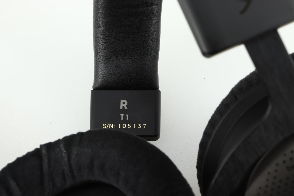 Close up of a used Beyer Dynamic T-1 GEN3 Headphones in a black/silver finish showing the serial number