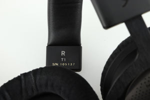 Close up of a used Beyer Dynamic T-1 GEN3 Headphones in a black/silver finish showing the serial number