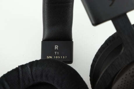 Close up of a used Beyer Dynamic T-1 GEN3 Headphones in a black/silver finish showing the serial number