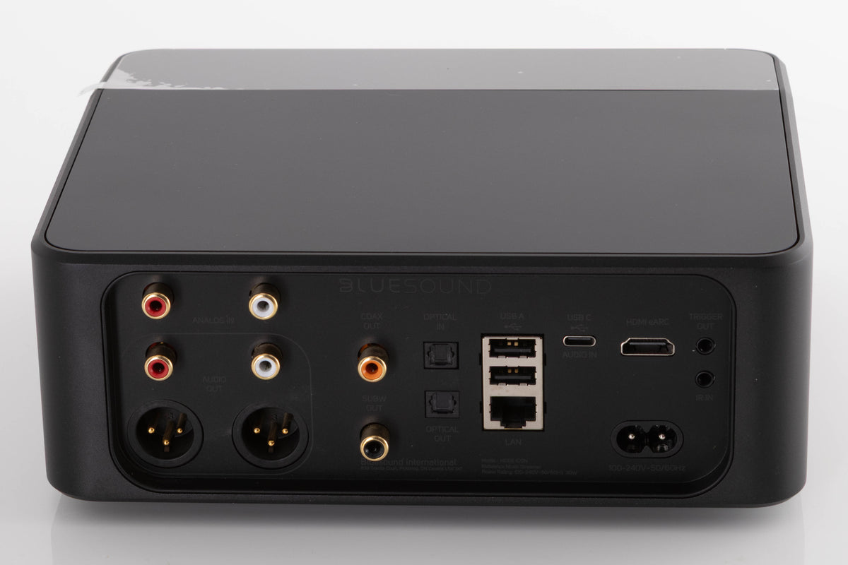 Rear view of a used Bluesound Node Icon Music Streamer in a Black finish showing Power Input, HDMI Input, USB Inputs, Optical Input, Optical Output, Phono Inputs, Phono Outputs, XLR Outputs and Coaxial Output