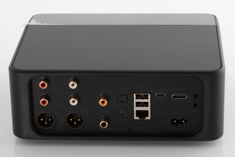 Rear view of a used Bluesound Node Icon Music Streamer in a Black finish showing Power Input, HDMI Input, USB Inputs, Optical Input, Optical Output, Phono Inputs, Phono Outputs, XLR Outputs and Coaxial Output