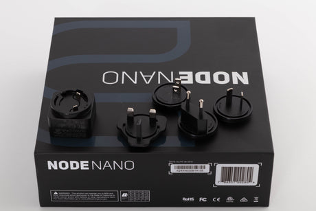 Box for a used Bluesound Node Nano Streamer in a Black finish showing PSU, Schuko Plug and Mains Plug