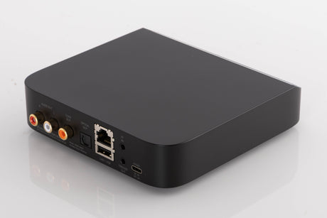 Rear left corner of a used Bluesound Node Nano Streamer in a Black finish