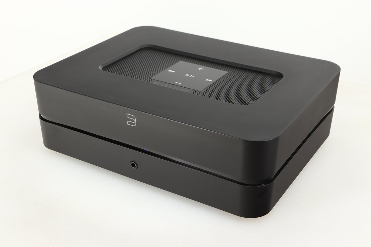 Close up of a used Bluesound Powernode 2i Streaming Amplifier in a black finish showing fascia