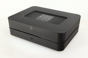 Close up of a used Bluesound Powernode 2i Streaming Amplifier in a black finish showing fascia