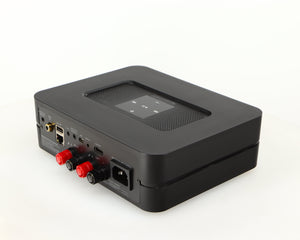 Rear left corner of a used Bluesound Powernode 2i Streaming Amplifier in a black finish