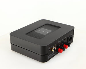 Rear right corner of a used Bluesound Powernode 2i Streaming Amplifier in a black finish