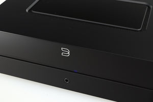 Close up of a used Bluesound Power Node Streamer in a black finish showing the fascia