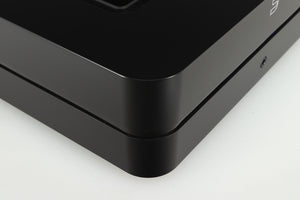 Front left corner of a used Bluesound PowerNode Streamer in a black finish