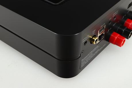 Rear right corner of a used Bluesound Power Node Streamer in a black finish