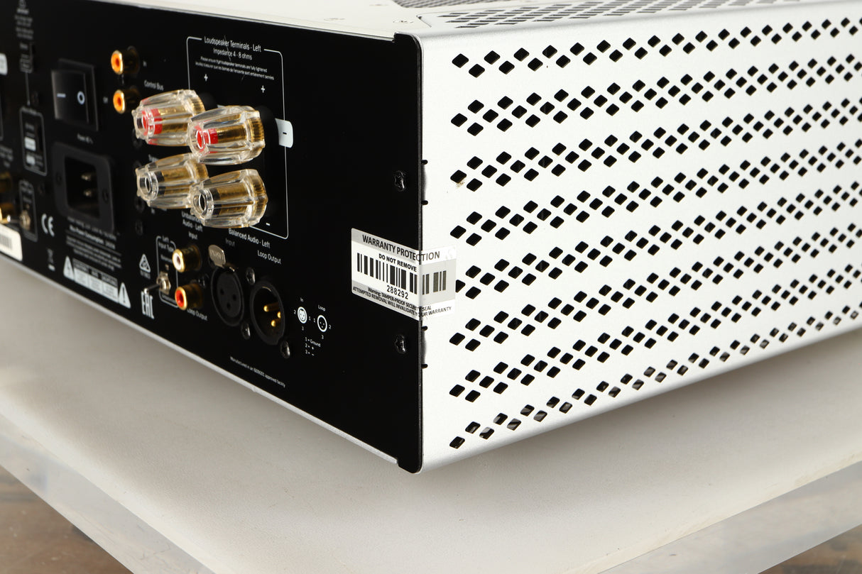 Rear left corner of a used Cambridge Audio 851W Power Amplifier in a silver finish