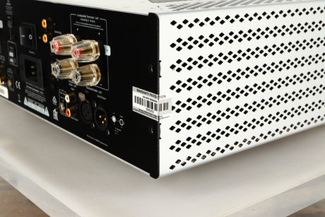 Rear left corner of a used Cambridge Audio 851W Power Amplifier in a silver finish