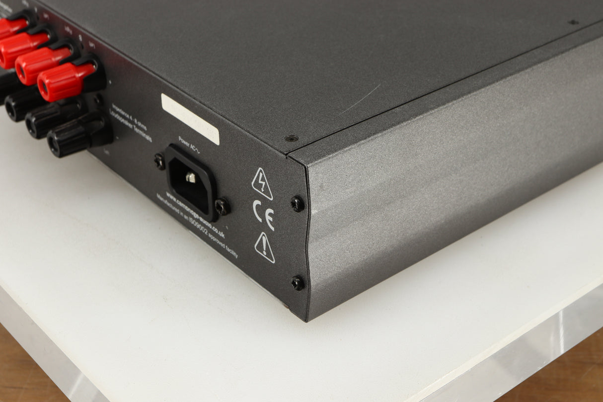 Rear left corner of a used Cambridge Audio 340A Integrated Amplifier in a black finish