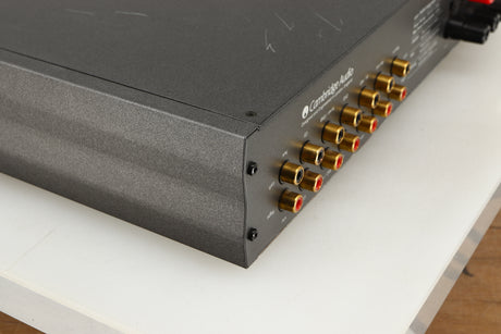 Rear right corner of a used Cambridge Audio 340A Integrated Amplifier in a black finish
