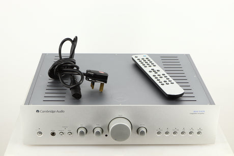 Top of a used Cambridge Audio Azur 640A Integrated Amplifier in a silver finish showing Mains Cable and Remote