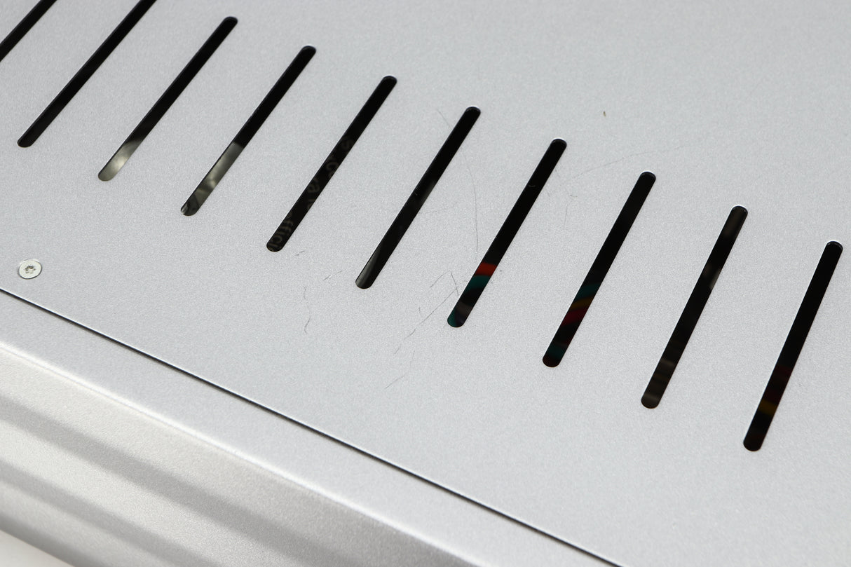 Close up of a used Cambridge Audio Azur 640A Integrated Amplifier in a silver finish showing scratching on top