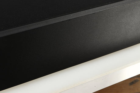 Close up of a used Cambridge Audio CD2 CD Player in a black finish showing scratches on left side