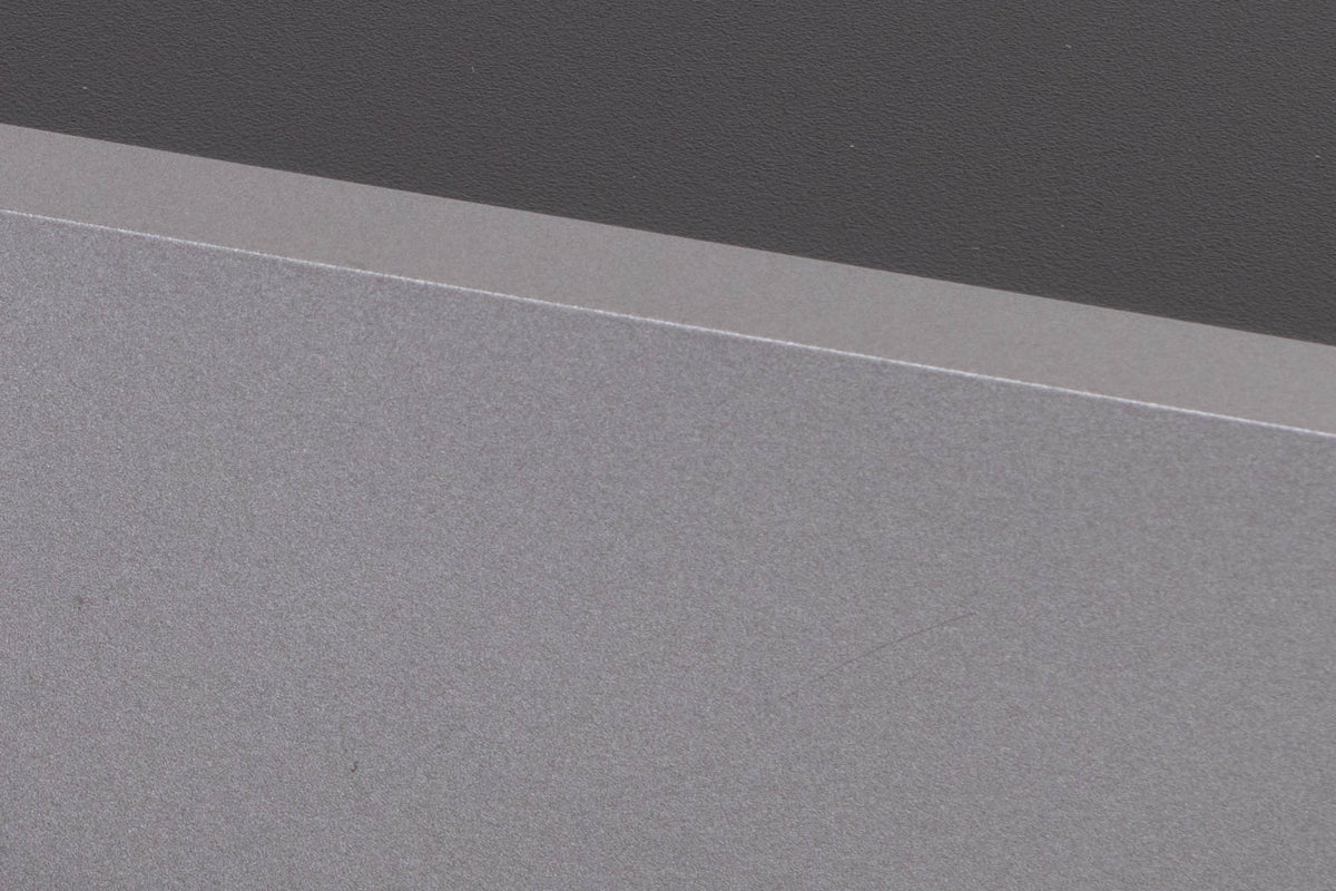 Close up of a used Cambridge Audio CXA81 Integrated Amplifier in a Lunar Grey finish showing scratch on fascia