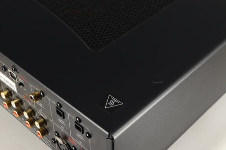 Close up of a used Cambridge Audio CXA81 Series 2 Integrated Amplifier in a lunar grey finish showing scratch on top