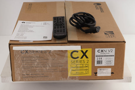 Box of a used Cambridge Audio CXN V2 Streamer in Lunar Grey finish with mains cable, manual, and remote