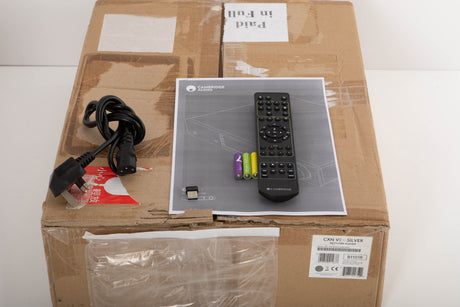 Box for a used Cambridge Audio CXN V2 Streamer in a silver finish showing Remote, Batteries, Mains Cable and Manual
