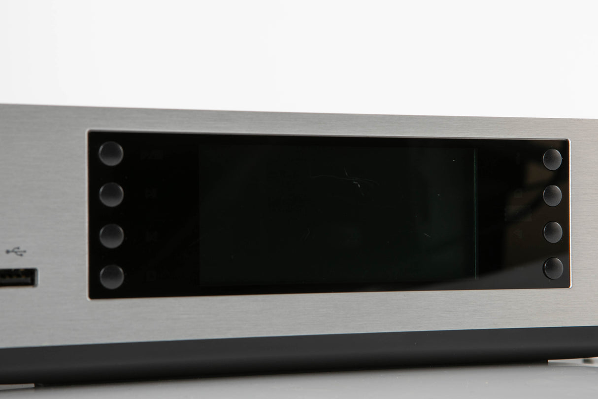 Close up of a used Cambridge Audio CXN V2 Streamer in a silver finish showing scratches on screen