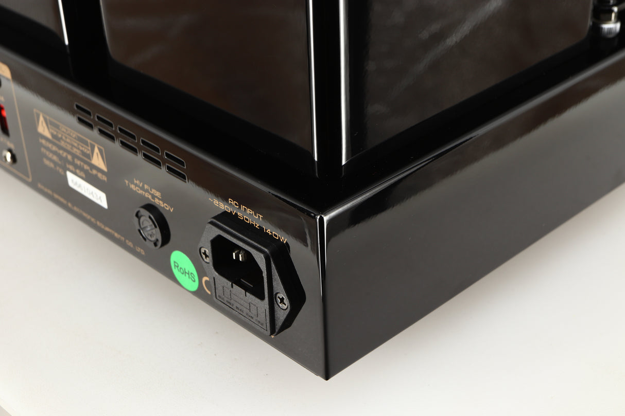 Rear left corner of a used Cayin HA-6A Headphone Amplifier in a black finish