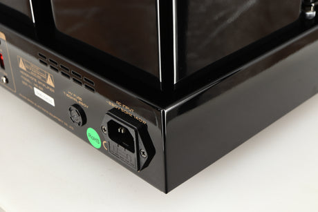Rear left corner of a used Cayin HA-6A Headphone Amplifier in a black finish