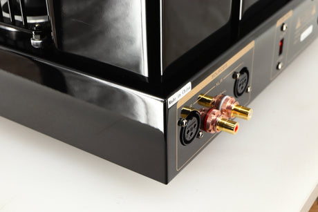 Rear right corner of a used Cayin HA-6A Headphone Amplifier in a black finish