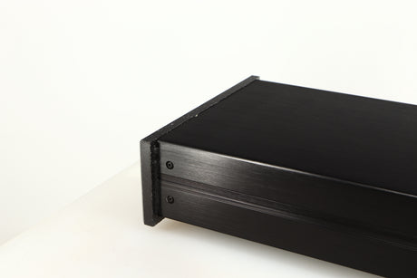 Close up of a used Charisma Audio Musiko Phonostage in a black finish showing dried up glue inside of fascia