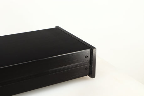 Close up of a used Charisma Audio Musiko Phonostage in a black finish showing dried up glue inside of fascia