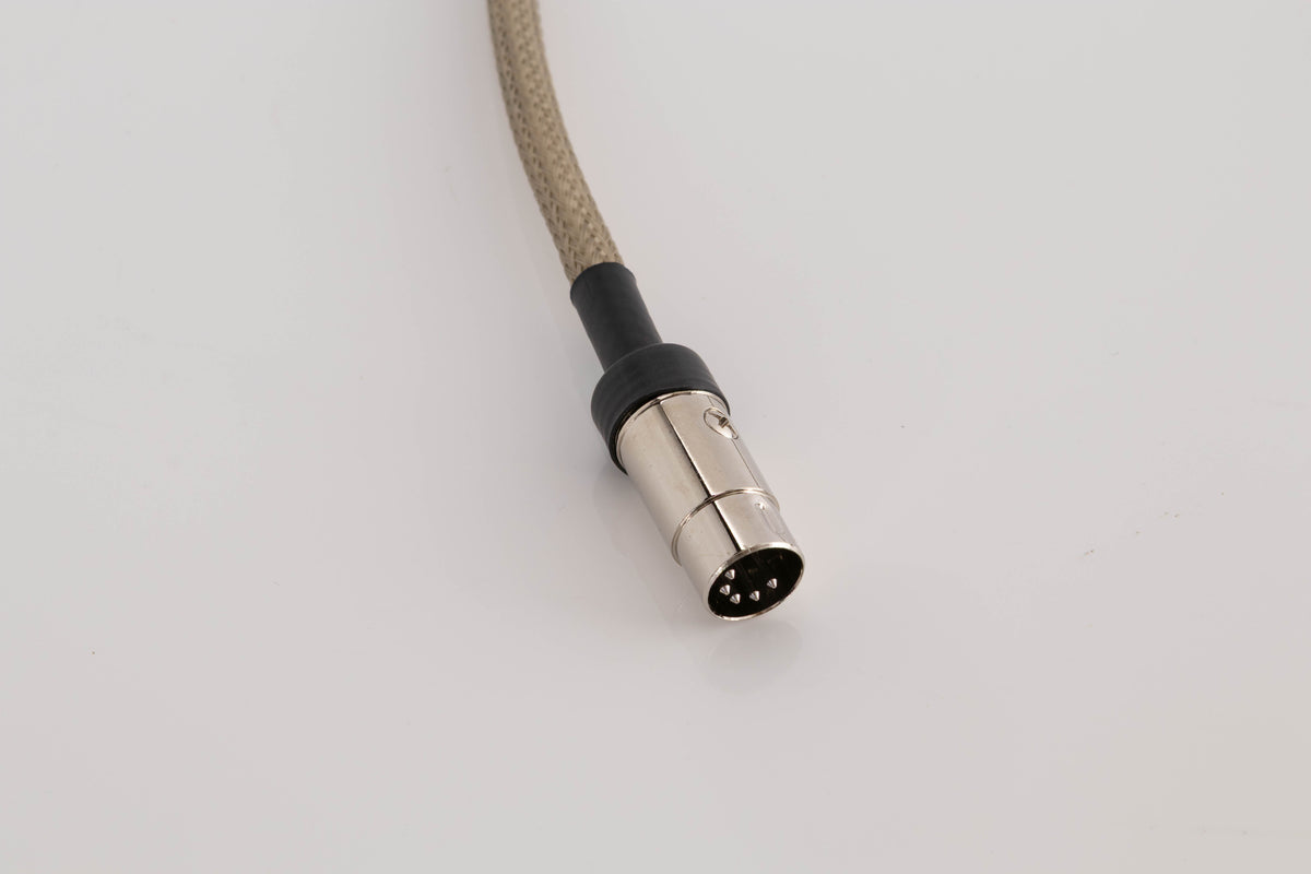 Close up view of a used Chord Company Epic X Aray 1.0m 2 RCA - Din Interconnect Cable
