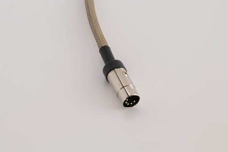 Close up view of a used Chord Company Epic X Aray 1.0m 2 RCA - Din Interconnect Cable