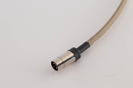 Close up view of a used Chord Company Epic X Aray 1.0m 2 RCA - Din Interconnect Cable