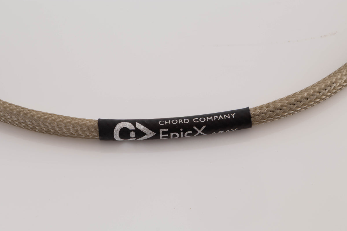 Close up view of a used Chord Company Epic X Aray 1.0m 2 RCA - Din Interconnect Cable