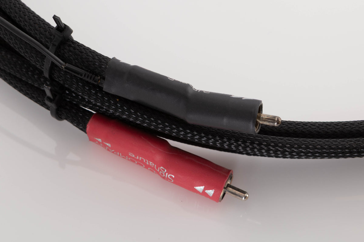 Close up of a used Chord Company Signature RCA-RCA 1.0m Interconnect Cable showing connectors