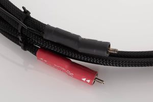 Close up of a used Chord Company Signature RCA-RCA 1.0m Interconnect Cable showing connectors