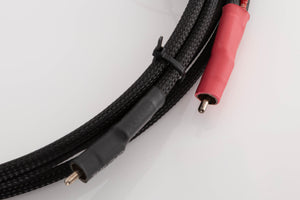 Close up of a used Chord Company Signature RCA-RCA 1.0m Interconnect Cable showing connectors