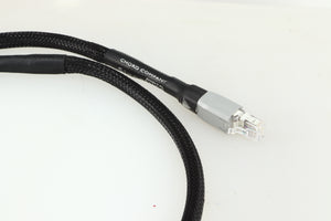 Close up of a used Chord Company Signature Super Aray Digital Streaming Cable 1.0m in a black finish showing the connector