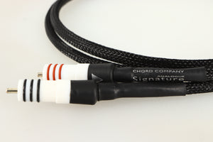 Close up of a used Chord Company Signature Tuned ARAY RCA-RCA Interconnect Cable 1.0m showing connectors