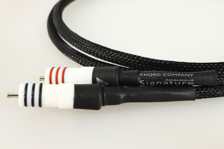Close up of a used Chord Company Signature Tuned ARAY RCA-RCA Interconnect Cable 1.0m showing connectors