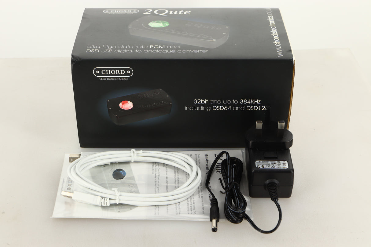 Box of a used Chord Electronics 2Qute DAC in Black finish with mains cable, manual, and USB cable 