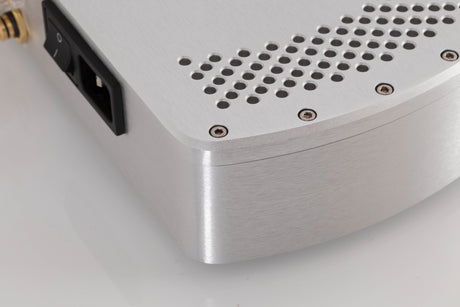 Rear left corner of a used Chord Electronics Etude Power Amplifier in a Silver finish