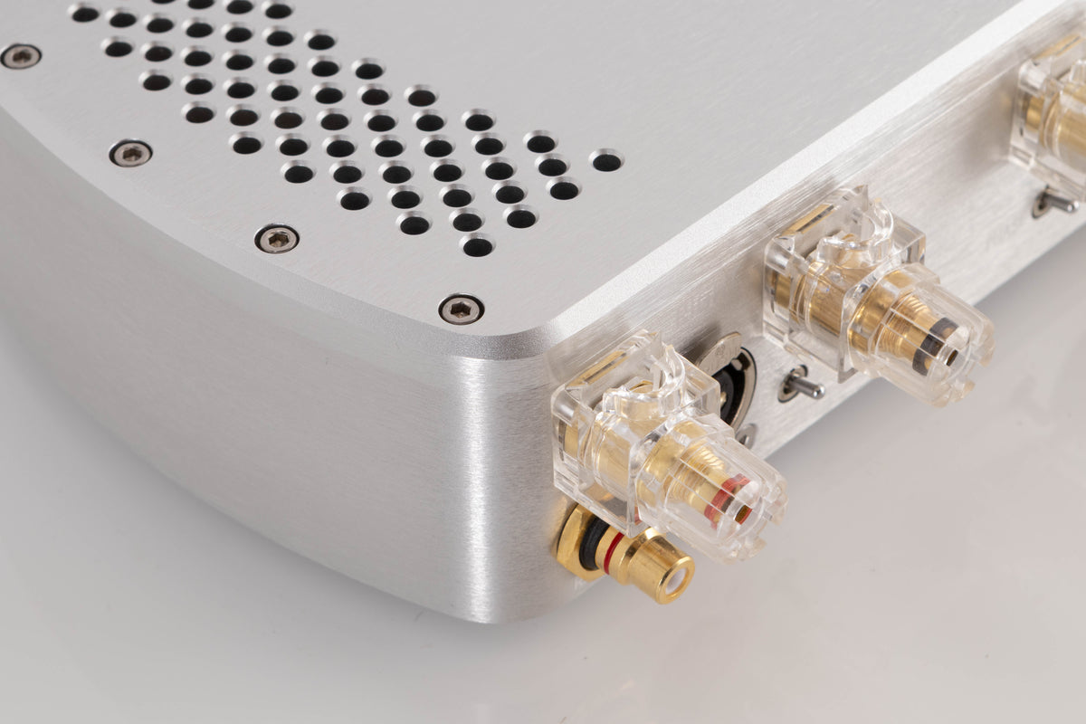 Rear right corner of a used Chord Electronics Etude Power Amplifier in a Silver finish