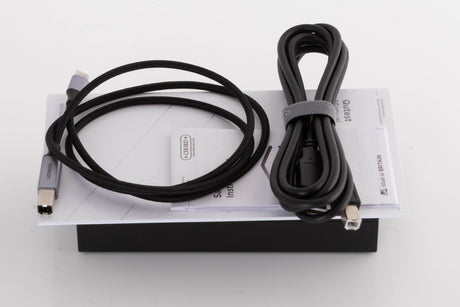 Accessories for a used Chord Electronics Qutest Digital Analogue Converter in a Black finish showing Manual and USB Cables