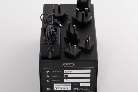 Box for a used Chord Electronics Qutest Digital Analogue Converter in a Black finish showing PSU, Mains Plug and Schuko Plug