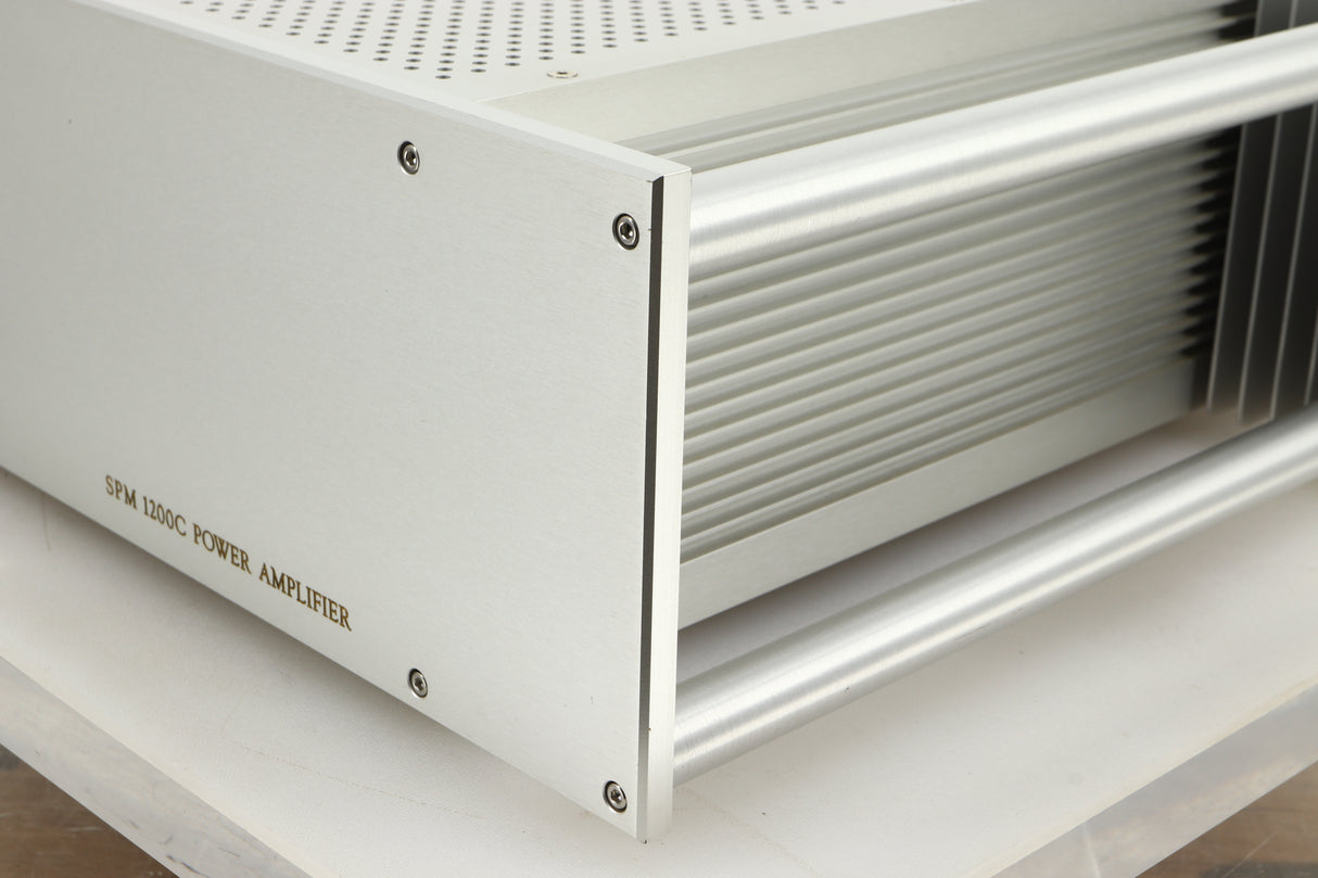 Front right corner view of a used Chord Electronics SPM1200C Power Amplifier in Silver finish
