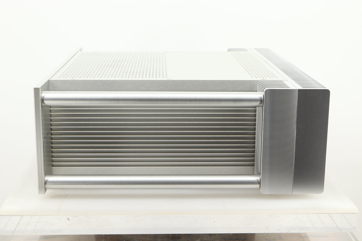 Side view of a used Chord Electronics SPM1200C Power Amplifier in Silver finish
