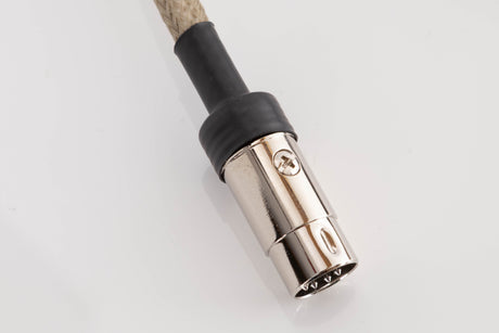 Close up of a used Chord Epic X 2RCA-DIN 1.0m Interconnect Cable showing connector
